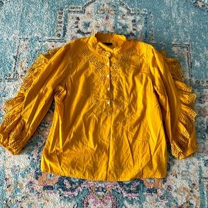 Ruffle-sleeve top with embroidered eyelet